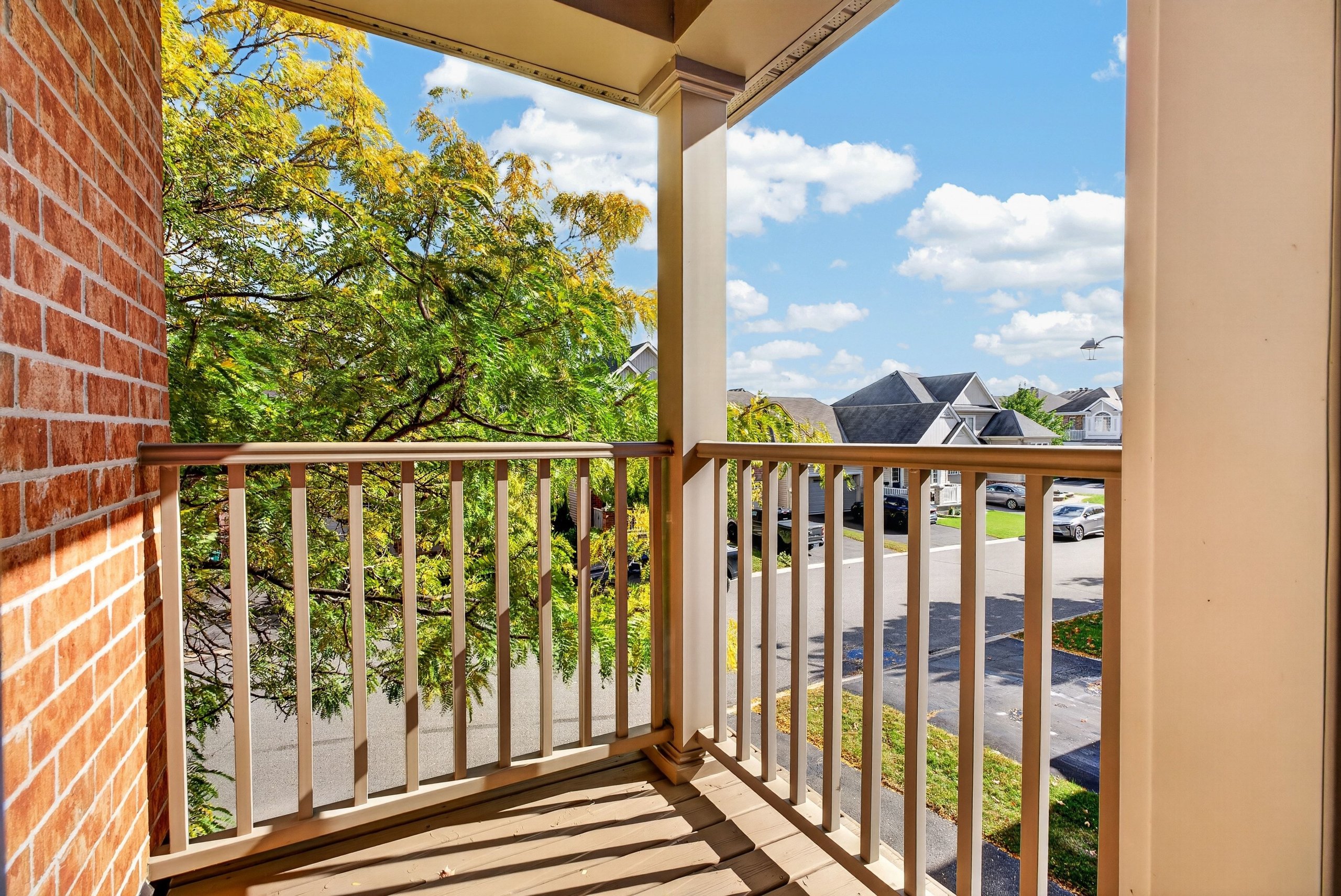 Covered second-floor balcony over the front porch